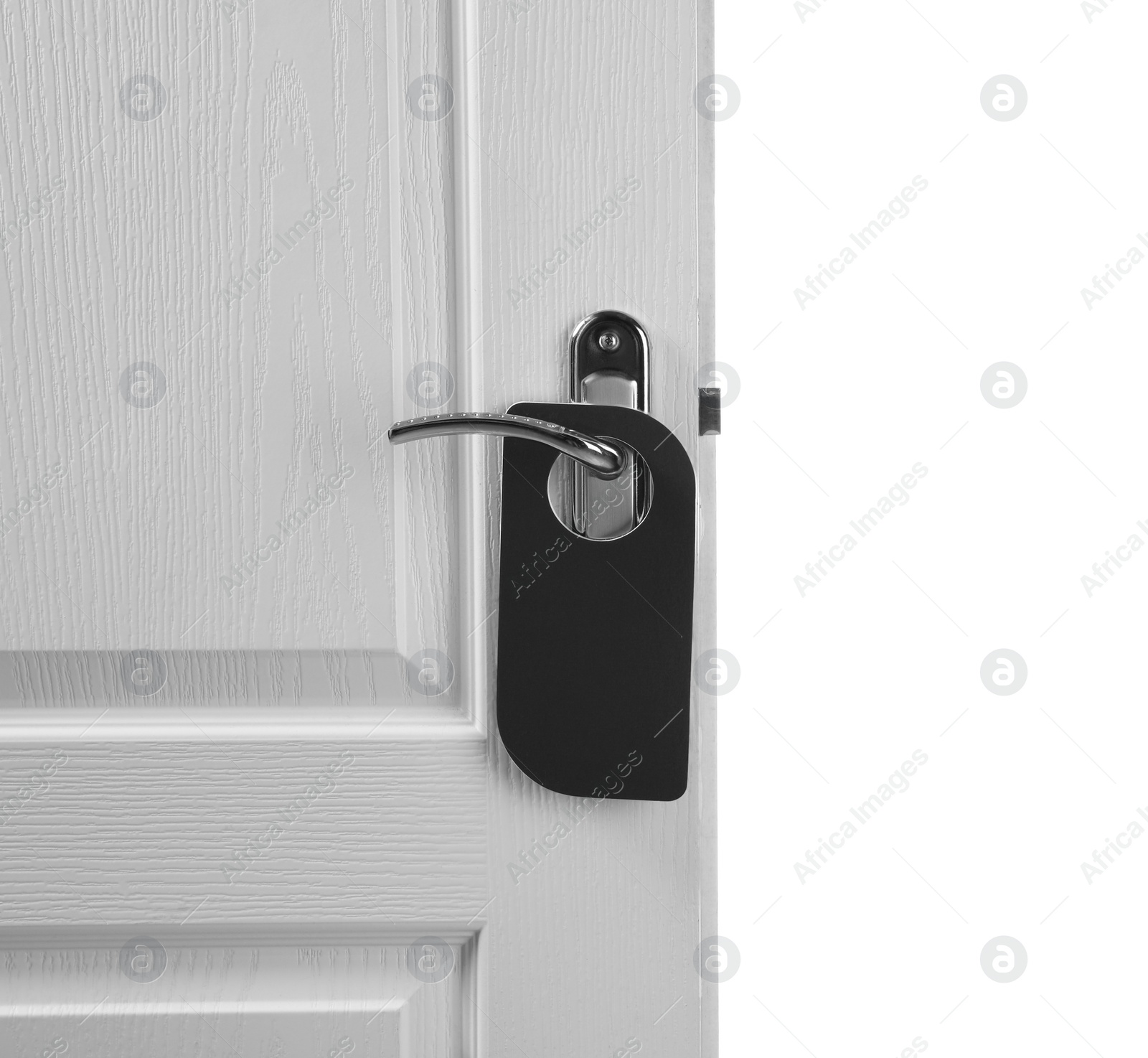 Photo of Hotel wooden door with blank hanger on white background, closeup