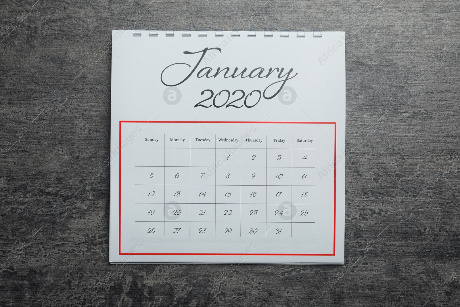Photo of January 2020 calendar on grey stone background, top view