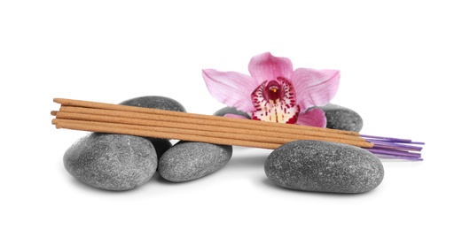Photo of Aromatic incense sticks, spa stones and orchid flower on white background