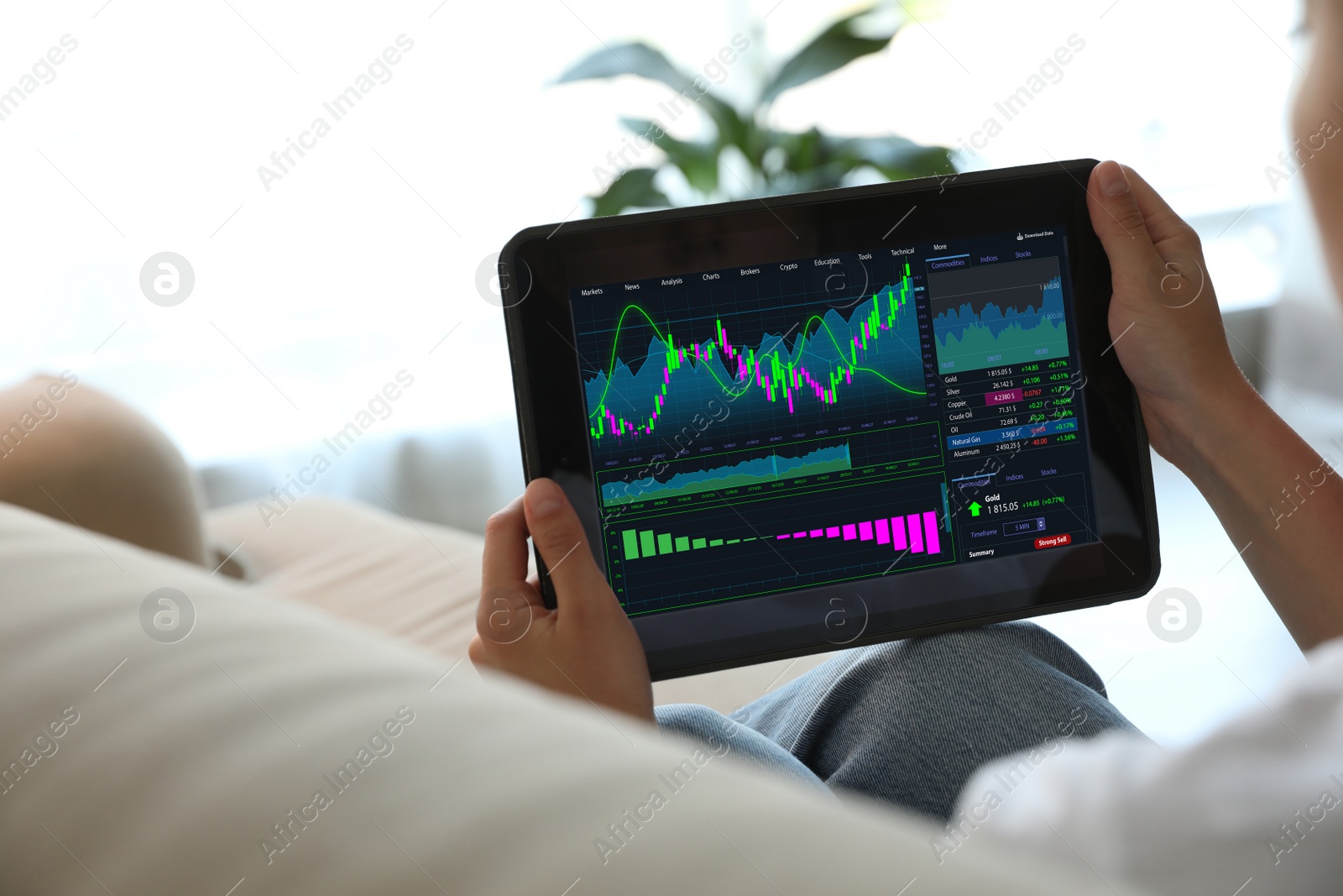 Image of Woman analyzing electronic trading platform on tablet indoors, closeup. Stock exchange