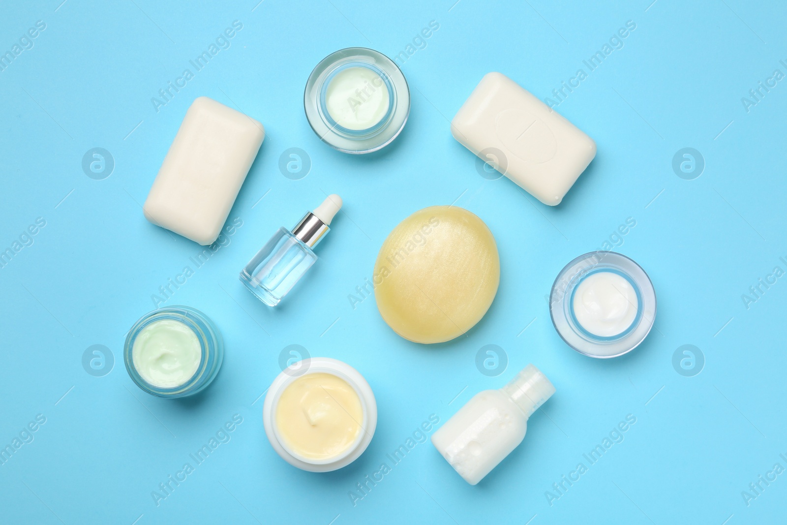 Photo of Flat lay composition with body care products on color background