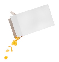 Photo of Pouring tasty corn flakes from paper box on white background. Breakfast cereal