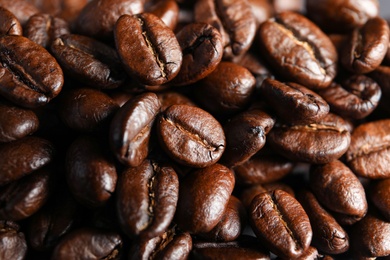 Roasted coffee beans as background, top view