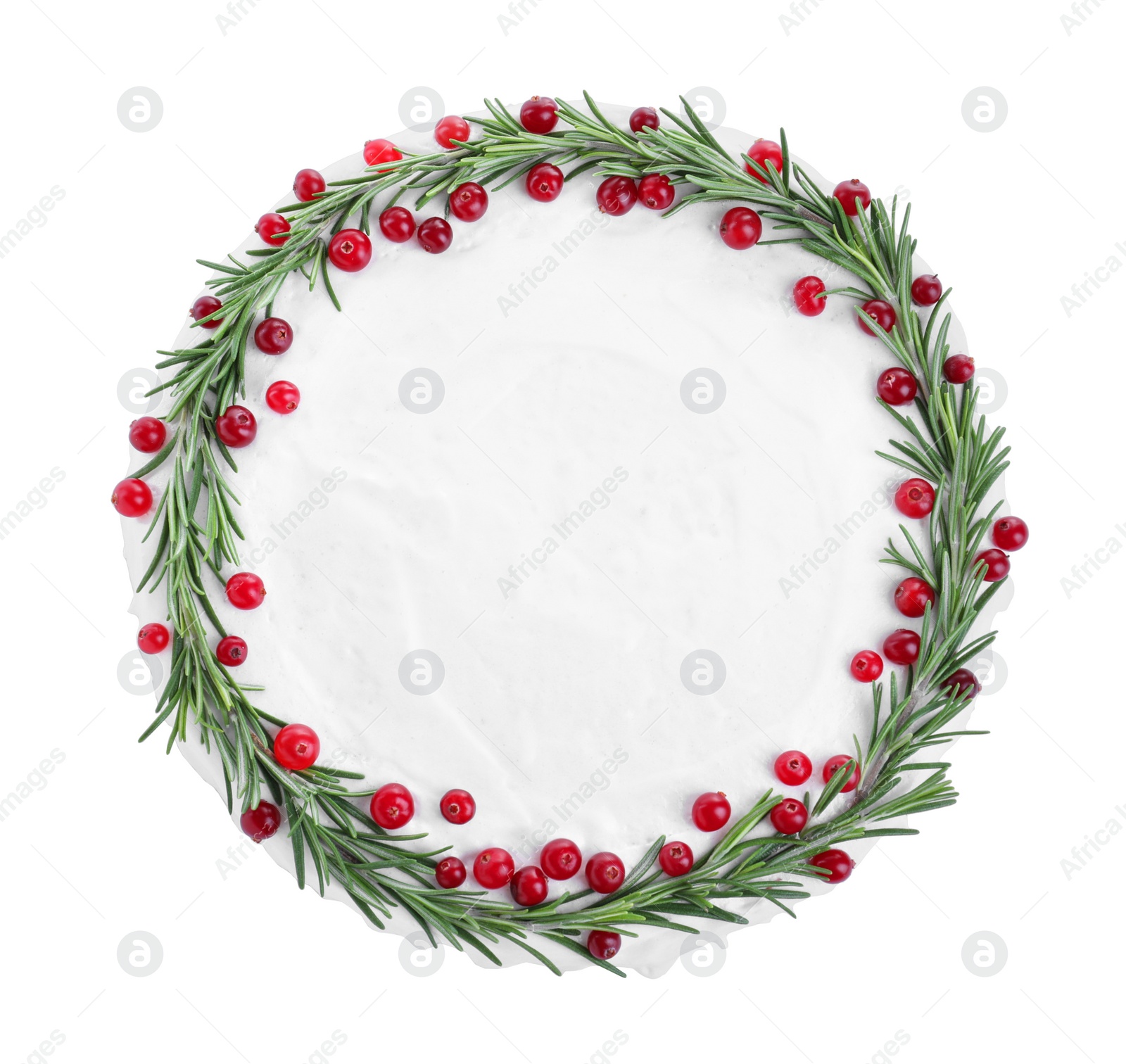 Photo of Traditional Christmas cake decorated with rosemary and cranberries isolated on white, top view