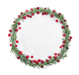 Photo of Traditional Christmas cake decorated with rosemary and cranberries isolated on white, top view