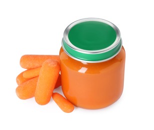 Photo of Tasty baby food in jar and fresh carrots isolated on white