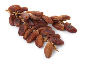 Sweet dates on branches against white background. Dried fruit as healthy snack