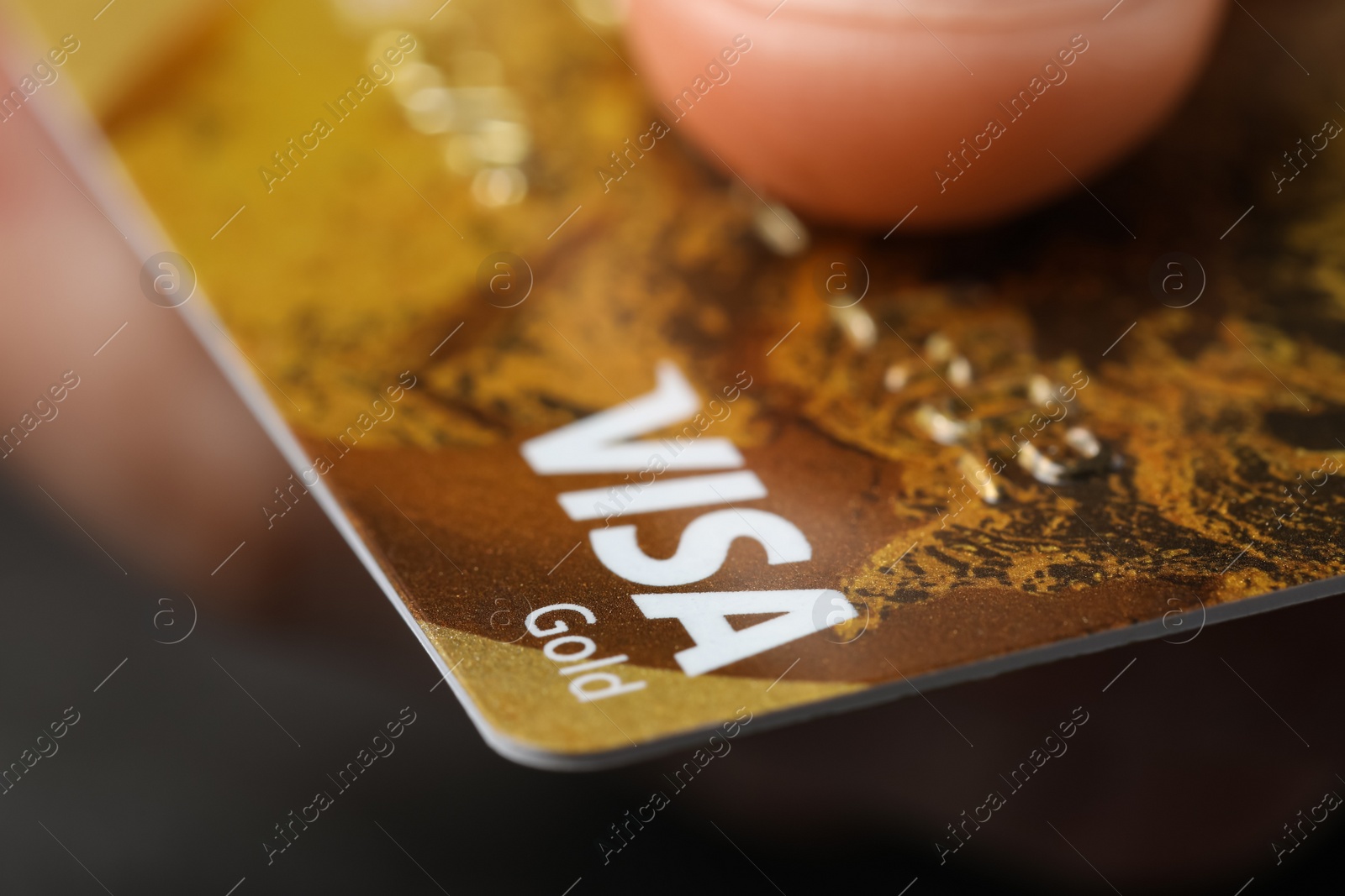 Photo of MYKOLAIV, UKRAINE - FEBRUARY 22, 2022: Woman holding Visa credit card, closeup