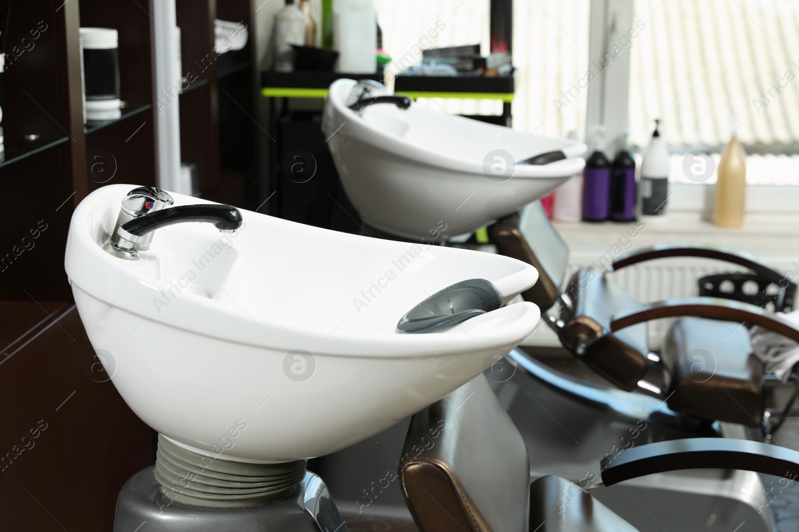 Photo of Hair washing sink in modern beauty salon