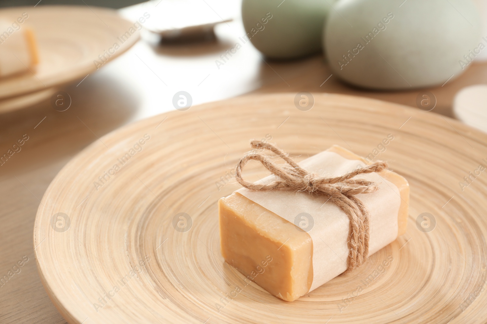 Photo of Plate with soap bar on table. Space for text