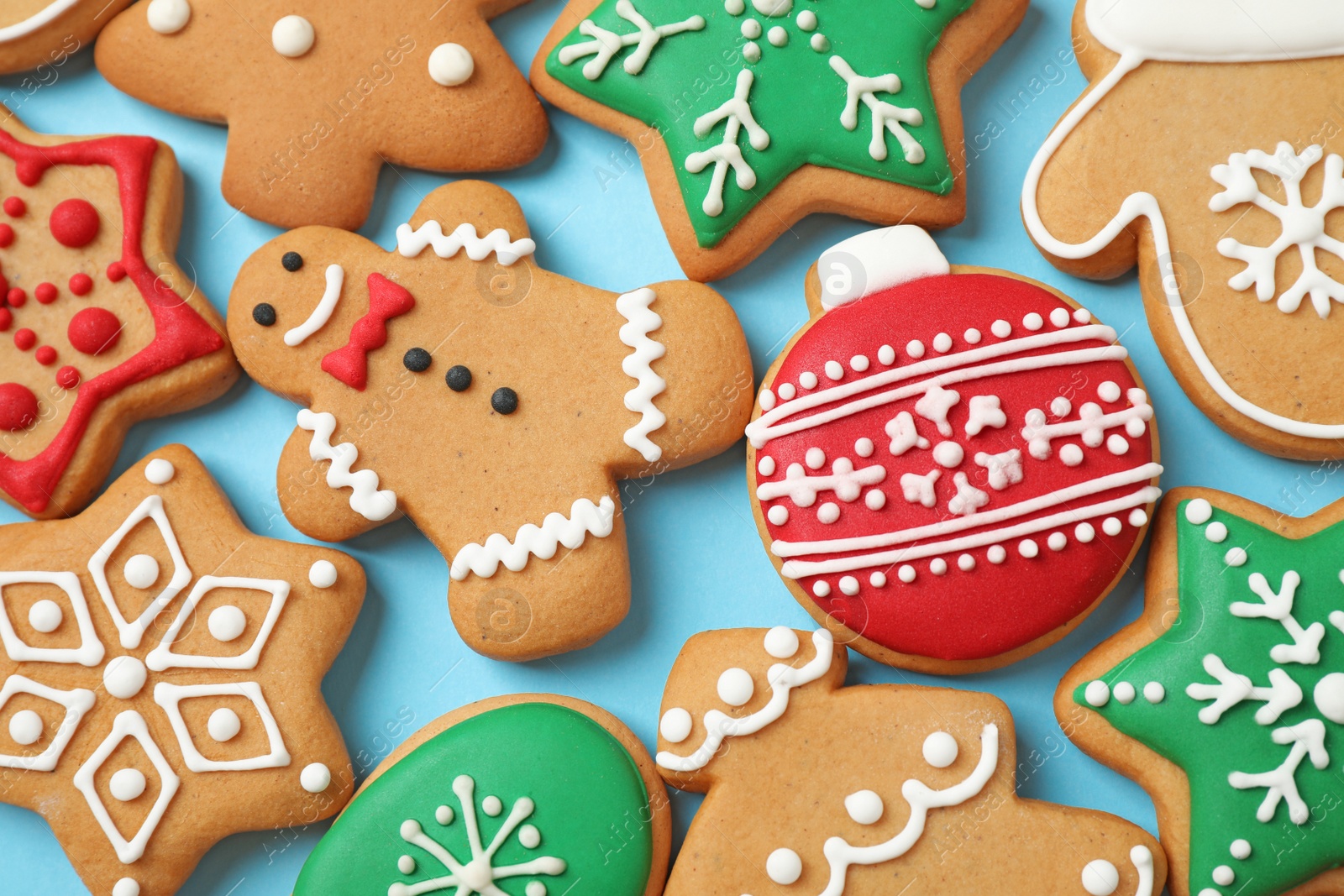 Photo of Flat lay composition with tasty homemade Christmas cookies on light blue background