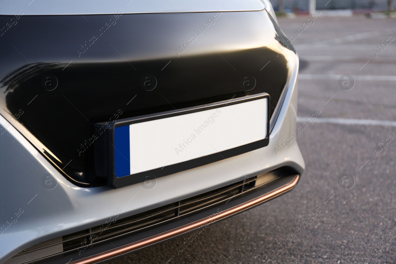 Photo of Vehicle registration plate on car outdoors, closeup