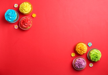 Photo of Delicious birthday cupcakes on color background