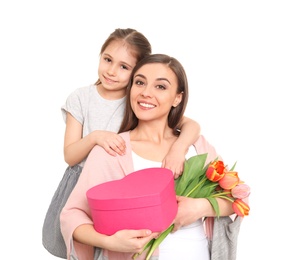 Photo of Portrait of happy woman with gifts and her daughter on white background. Mother's day celebration