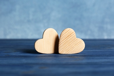 Couple of small wooden hearts on table