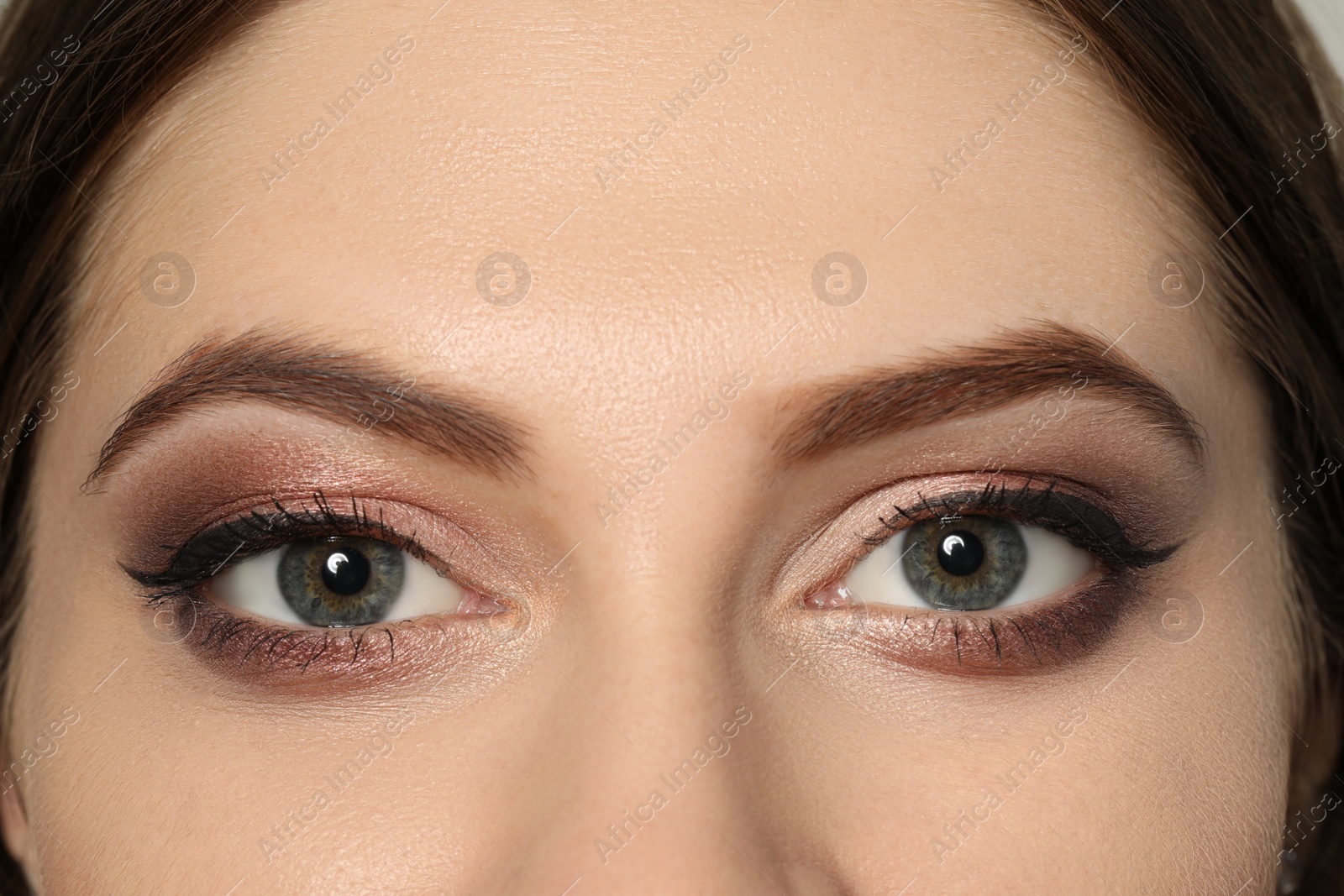 Photo of Young woman with beautiful eyebrows, closeup view