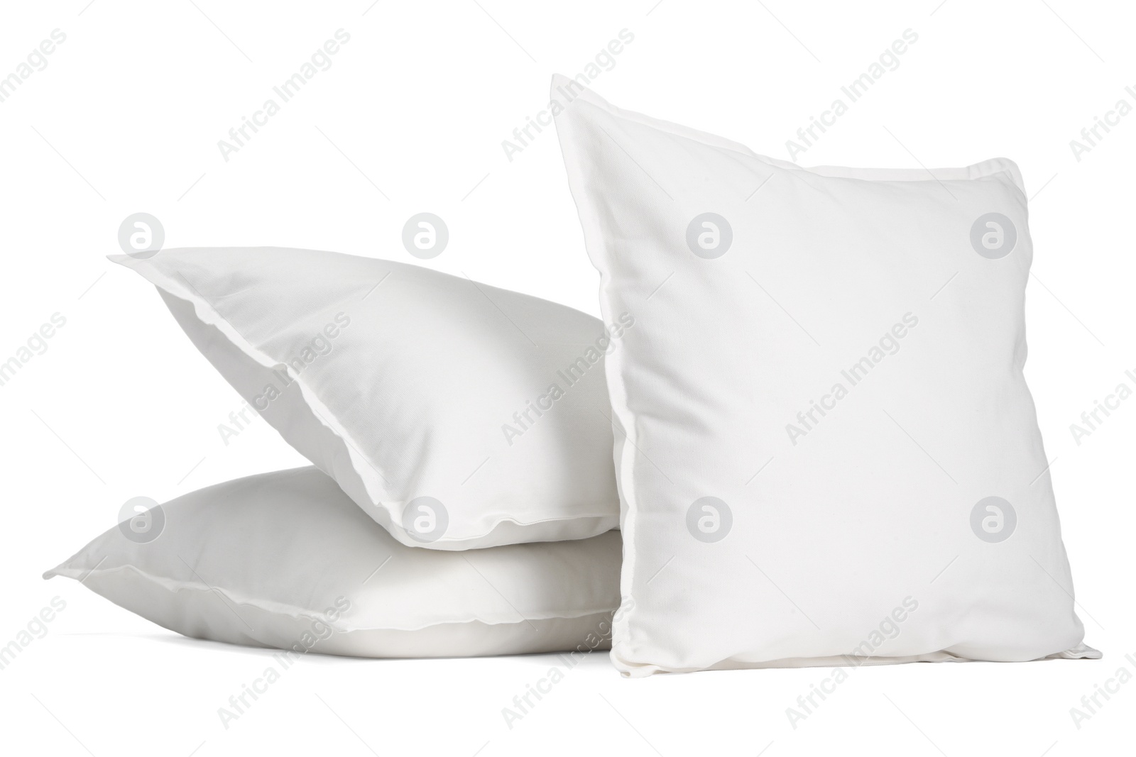 Photo of Three new soft pillows isolated on white