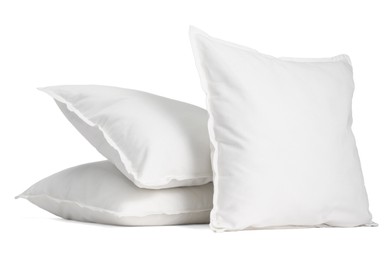 Photo of Three new soft pillows isolated on white