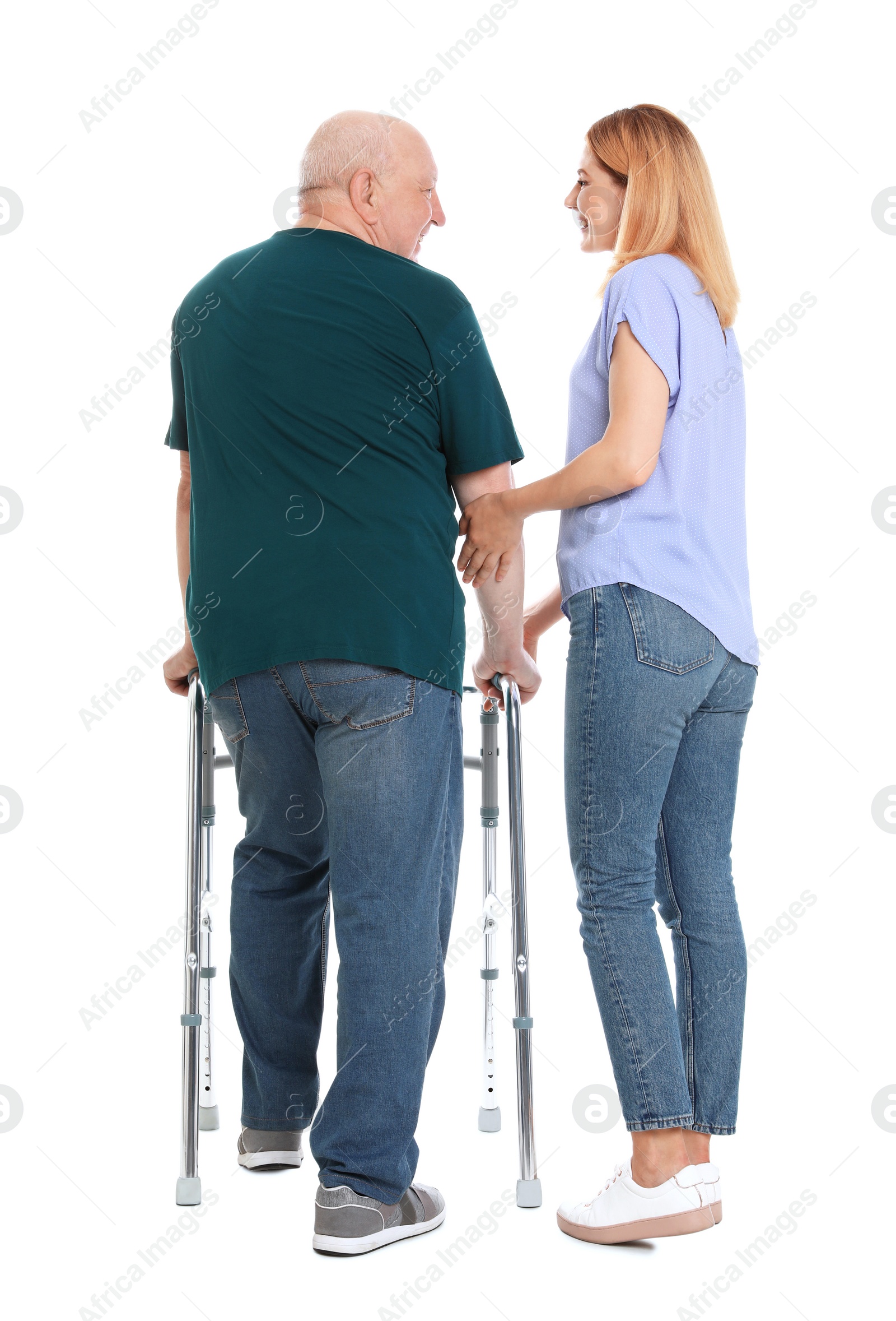 Photo of Caretaker helping elderly man with walking frame on white background