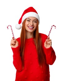 Photo of Young woman in red sweater and Santa hat with candy canes on white background. Christmas celebration