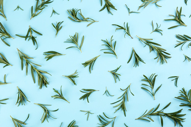 Photo of Flat lay composition with fresh rosemary on light blue background