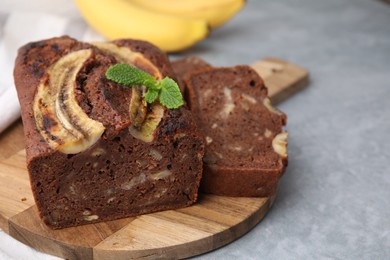 Photo of Delicious banana bread on grey table, closeup