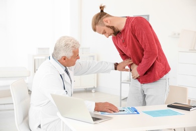 Photo of Man with health problems visiting urologist at hospital