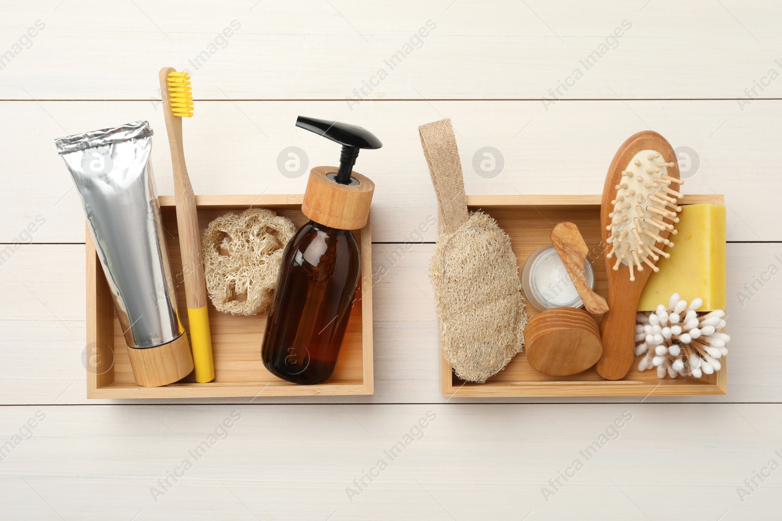 Photo of Boxes with eco friendly products on white wooden table, flat lay