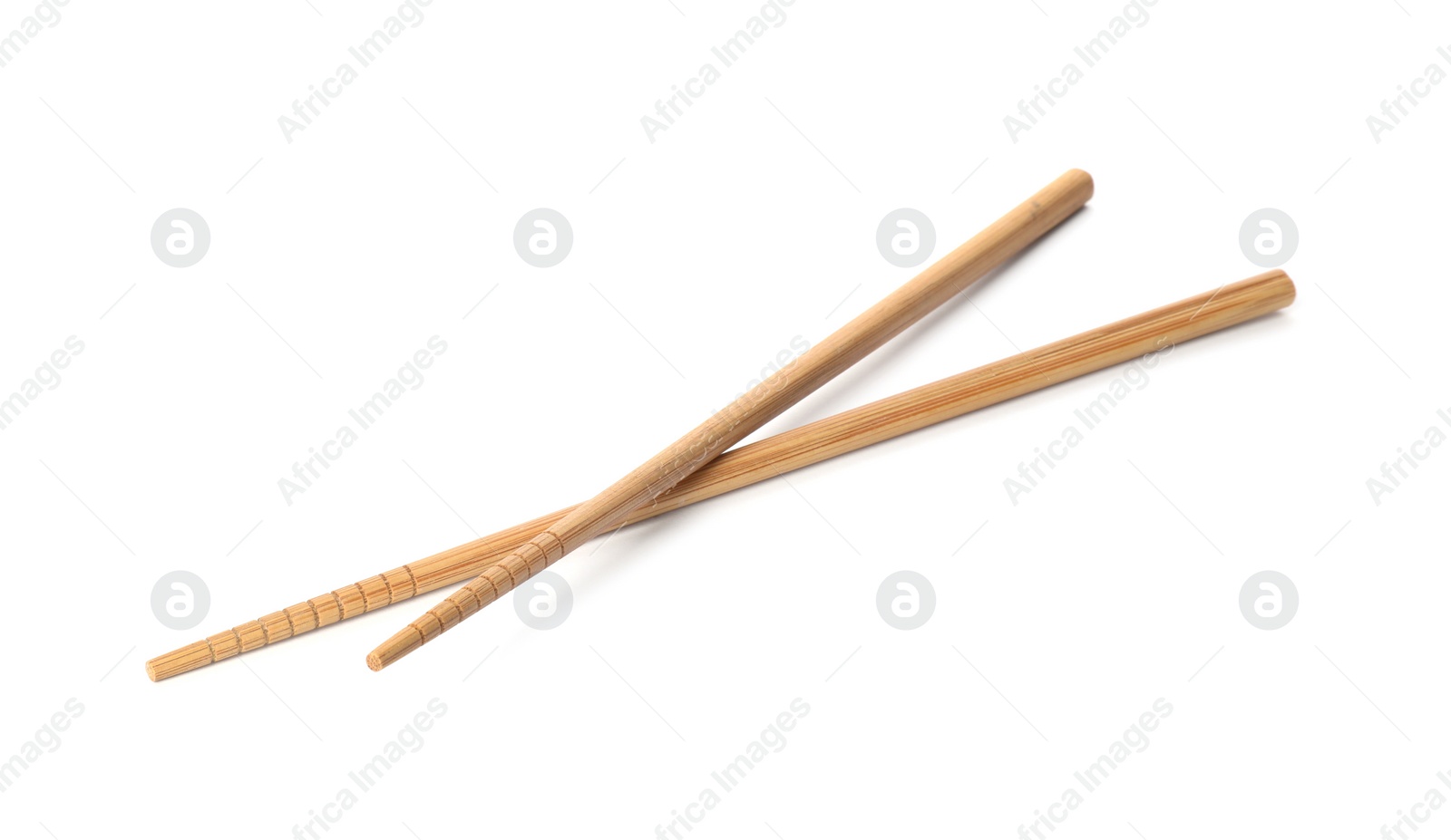 Photo of Chopsticks made of bamboo on white background