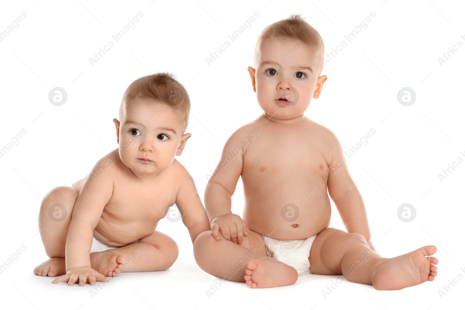 Image of Portrait of cute twin babies on white background