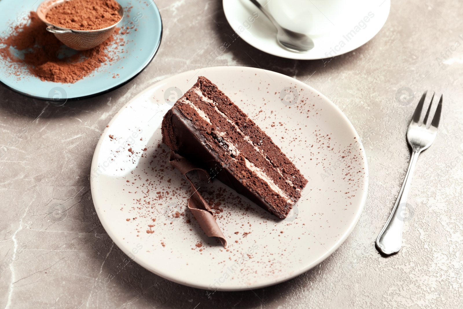 Photo of Plate with slice of tasty homemade chocolate cake on table