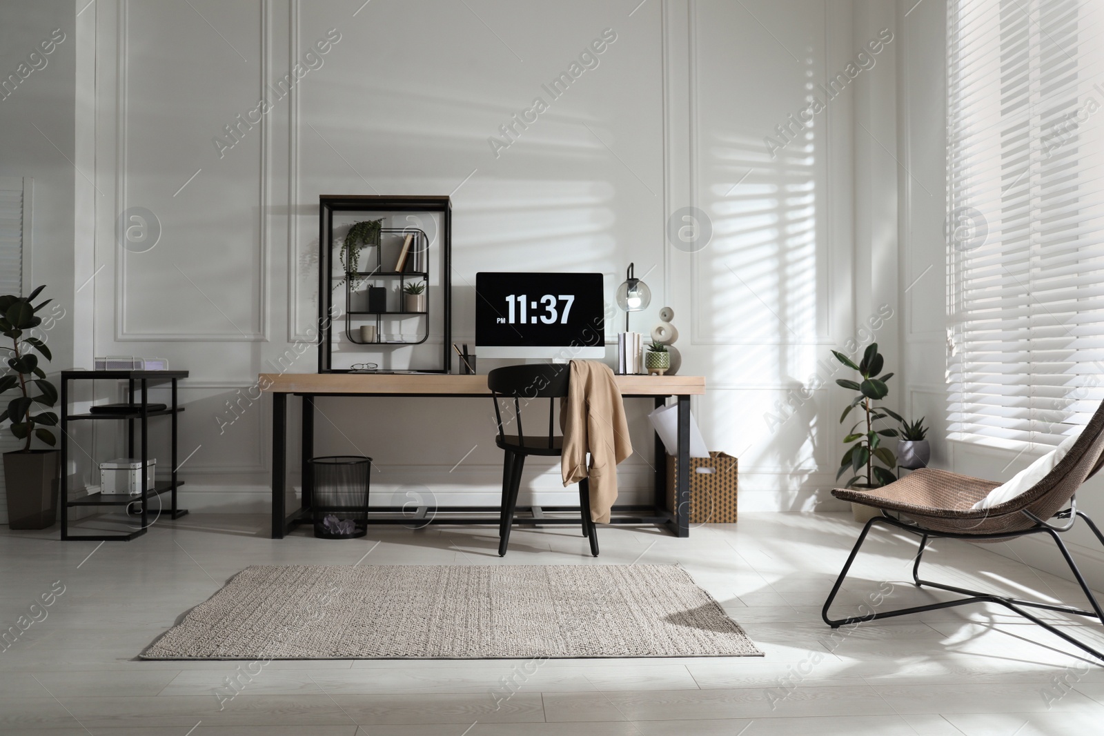 Photo of Room interior with comfortable workplace. Modern computer on wooden desk