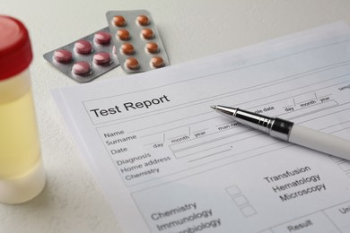 Photo of Drug test result form, pills and pen on light table, closeup