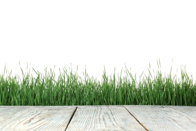 Photo of Wooden deck and green grass isolated on white