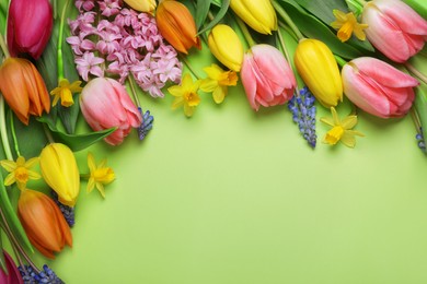 Beautiful different flowers on green background, flat lay. Space for text