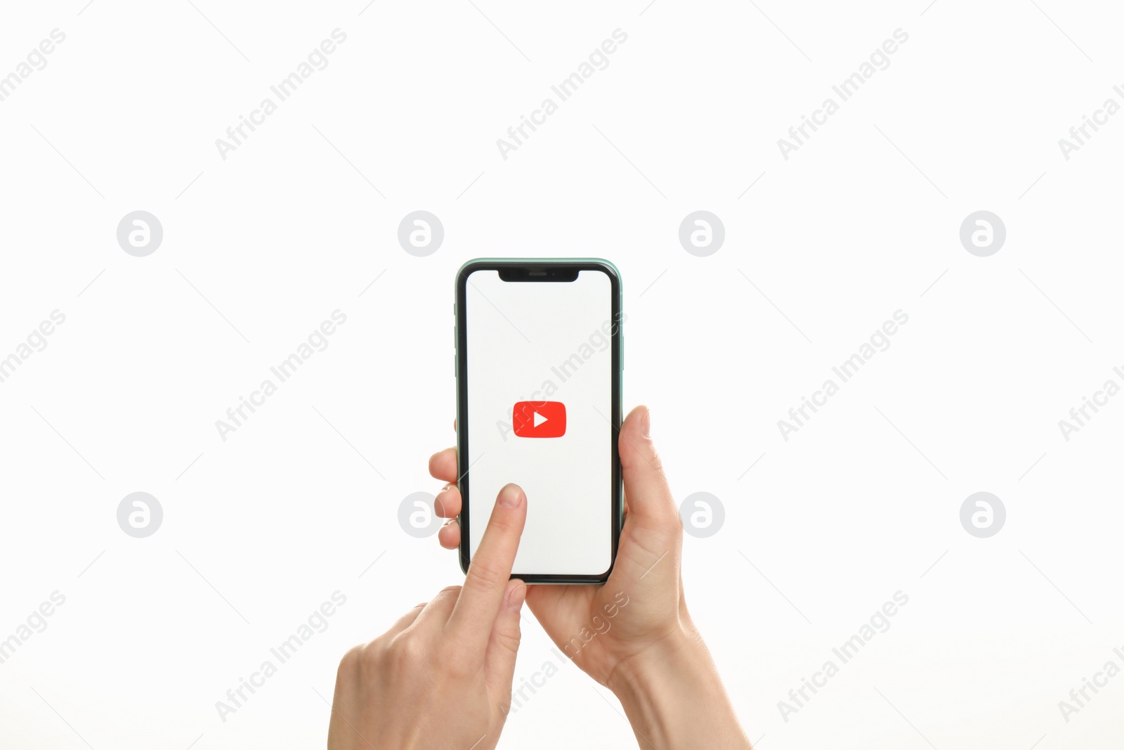 Photo of MYKOLAIV, UKRAINE - JULY 9, 2020: Woman holding  iPhone X with Youtube app on white background, closeup