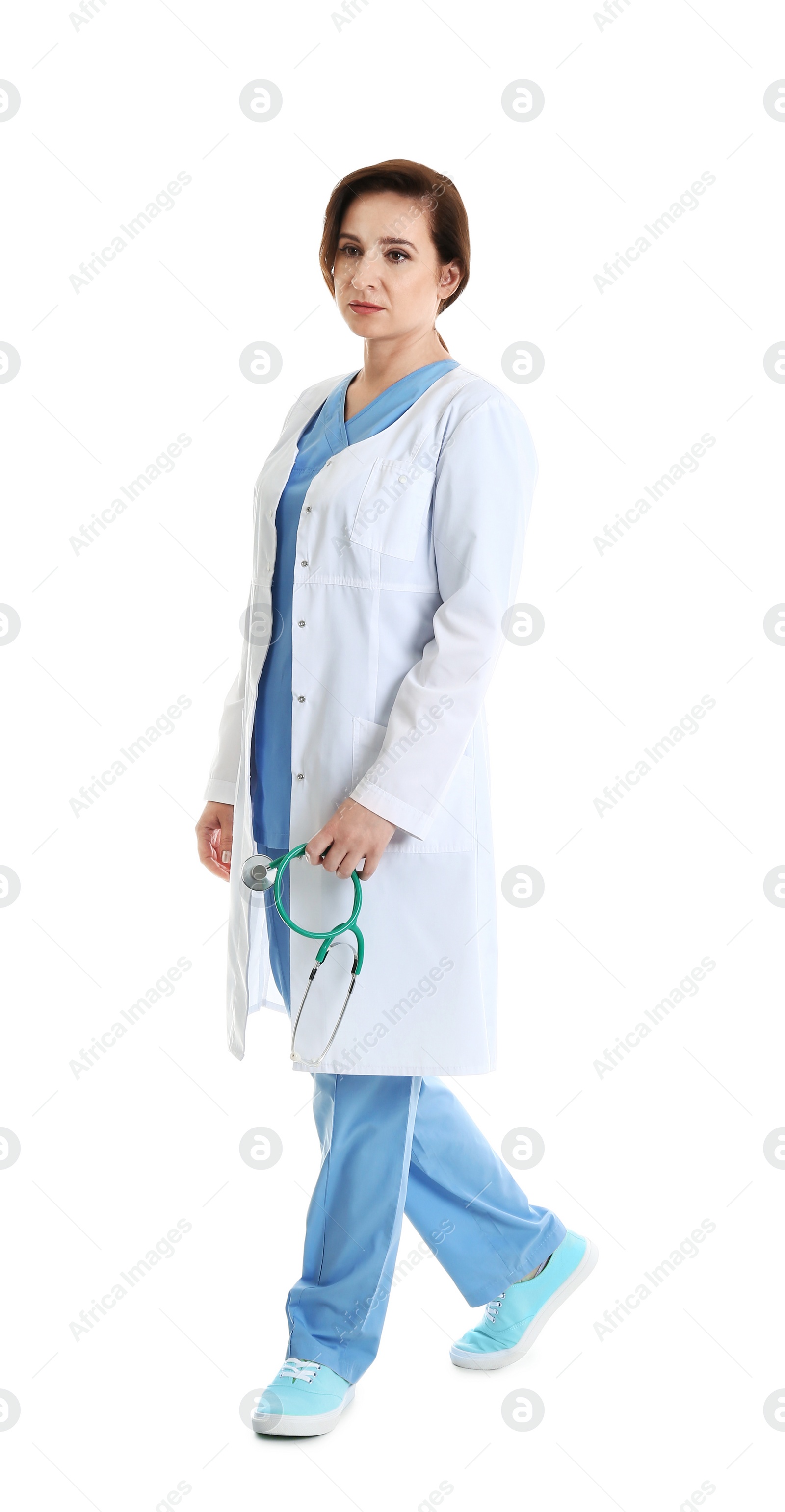 Photo of Full length portrait of experienced doctor in uniform on white background. Medical service