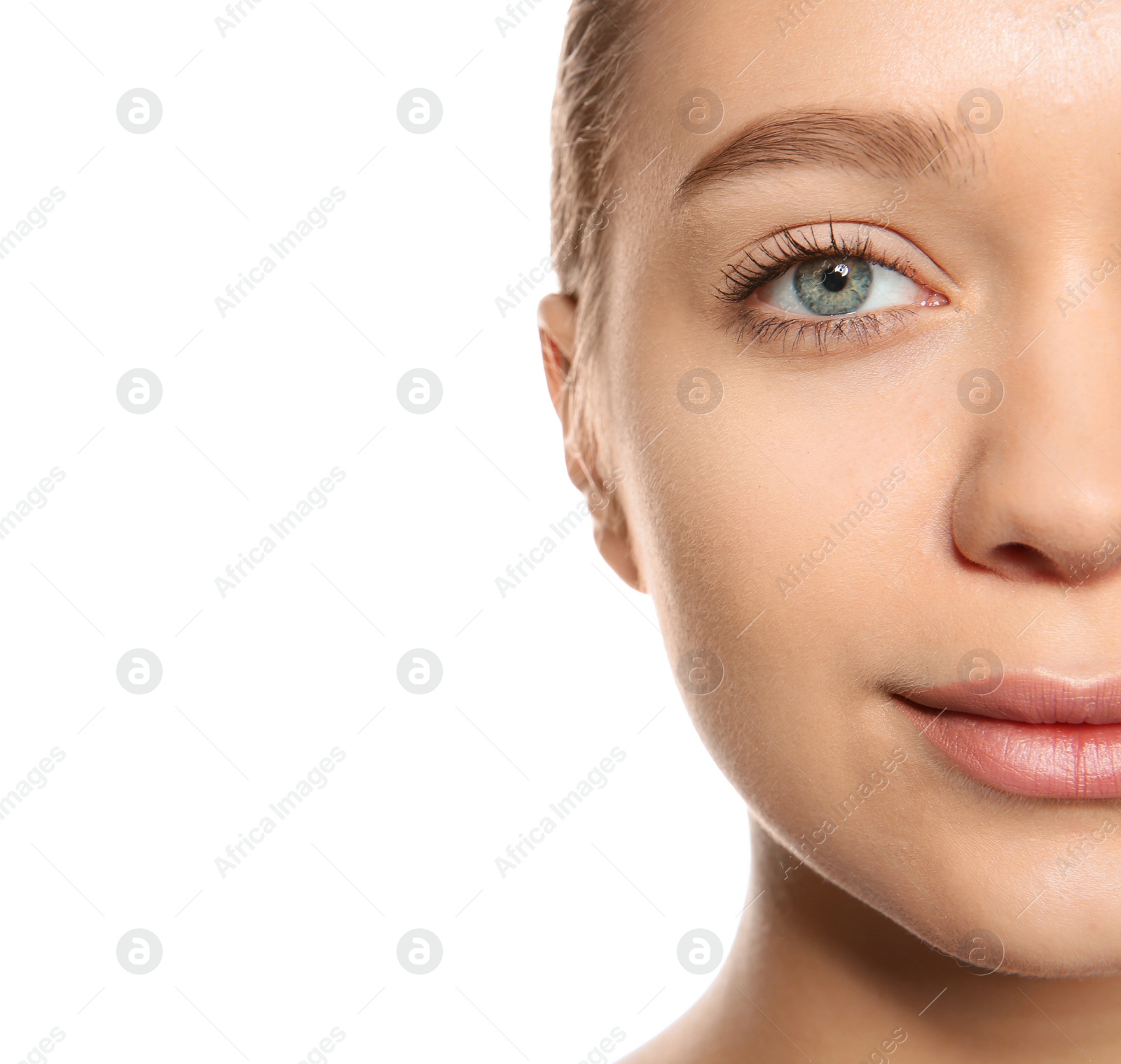 Photo of Portrait of young woman with foundation on her face against white background, closeup