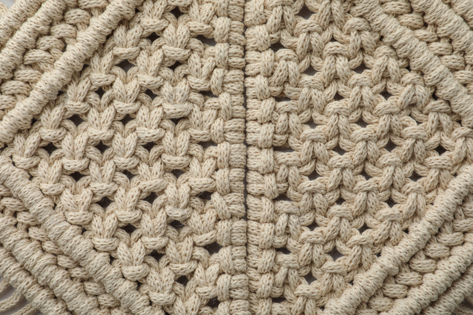 Photo of Texture of beautiful macrame as background, top view. Decorative element