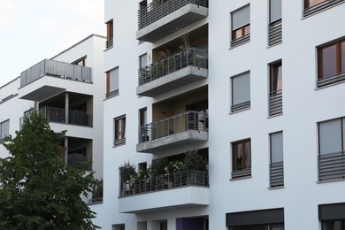 Photo of Beautiful view of modern buildings with big windows outdoors