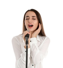 Young stylish woman singing in microphone on white background