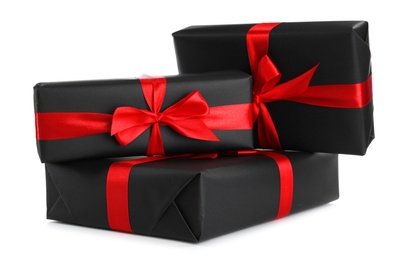 Black gift boxes with bows isolated on white