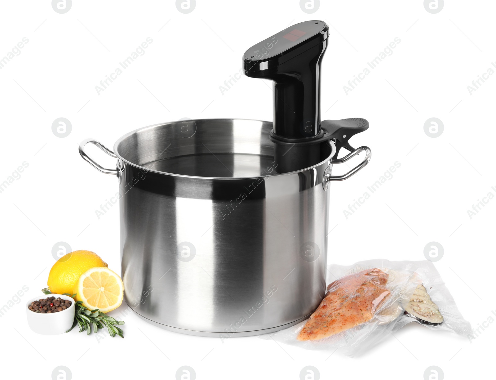 Photo of Thermal immersion circulator in pot and ingredients on white background. Sous vide cooking