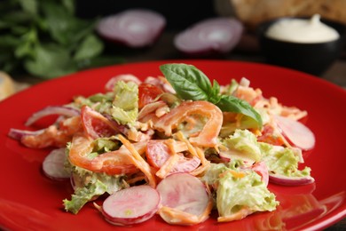 Photo of Delicious salad with mayonnaise on plate, closeup