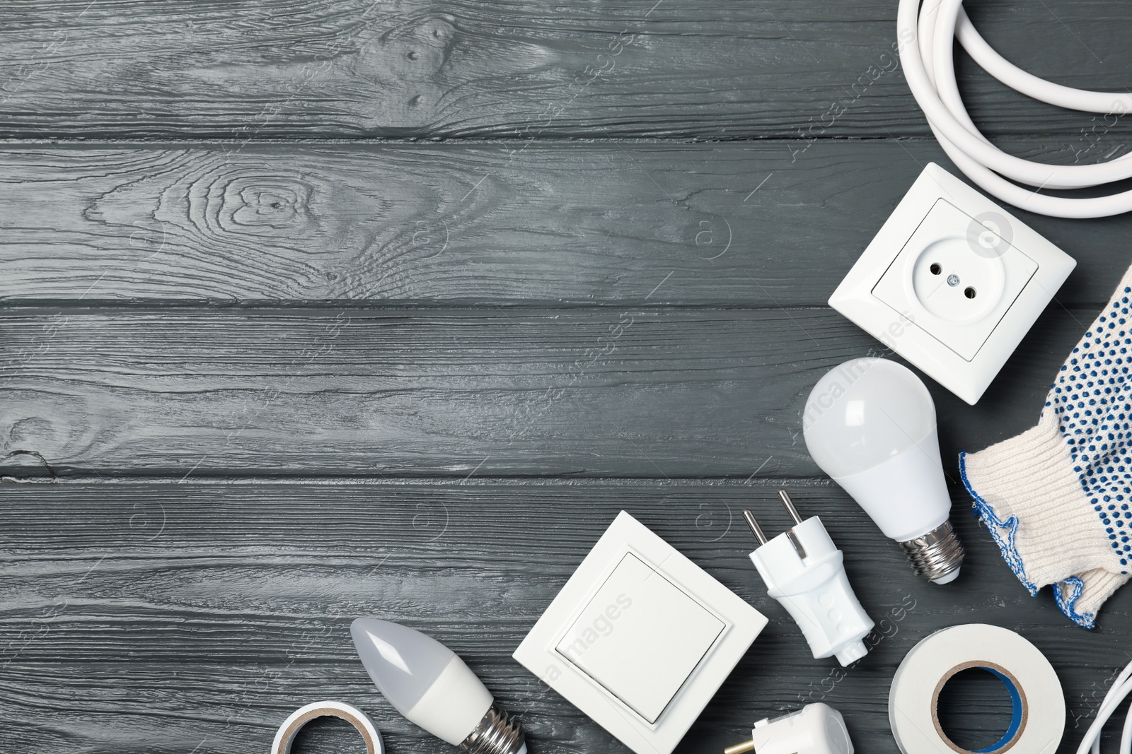 Photo of Flat lay composition with electrician's tools and space for text on wooden background