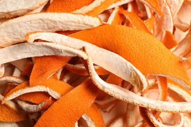 Photo of Many dry orange peels on white table, closeup