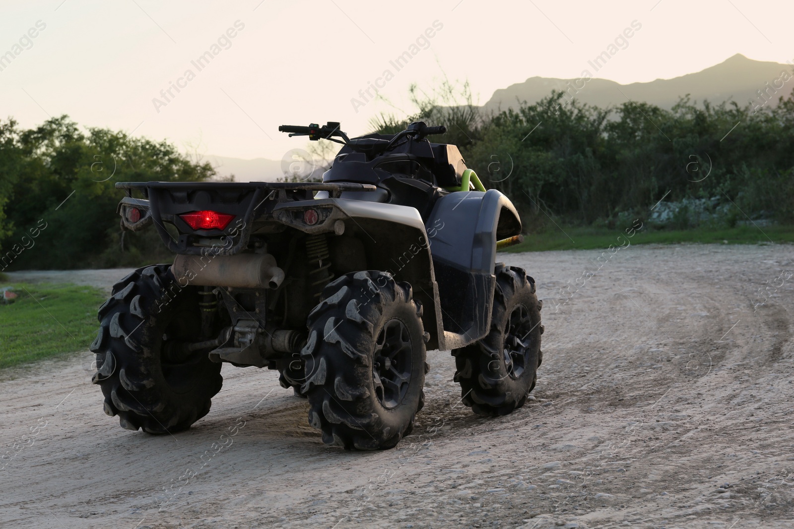 Photo of Modern fast quad bike on pathway outdoors