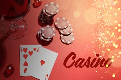 Illustration of Word Casino, chips, playing cards, dice and cocktail on red table, flat lay. Bokeh effect