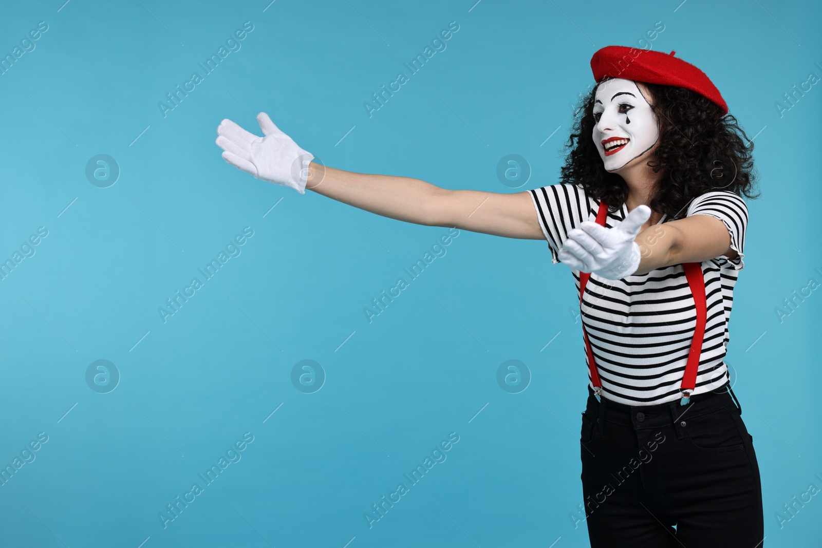 Photo of Funny mine with beret posing on light blue background, space for text