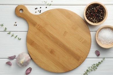 Photo of Cutting board and different spices on white wooden table, flat lay